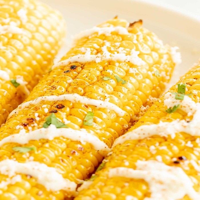 Grilled corn with garlic mayo & grated cheese — vegetarian