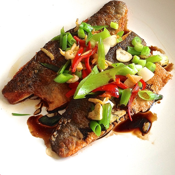 Sea bass with sizzled ginger, chilli & spring onions — a Vietnam dish